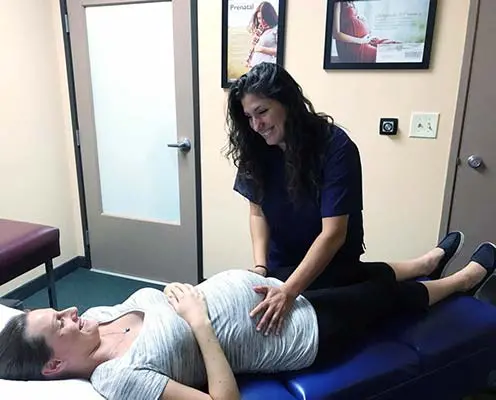 Chiropractor Simi Valley CA Dr. Heather Valinsky with Adult Patient