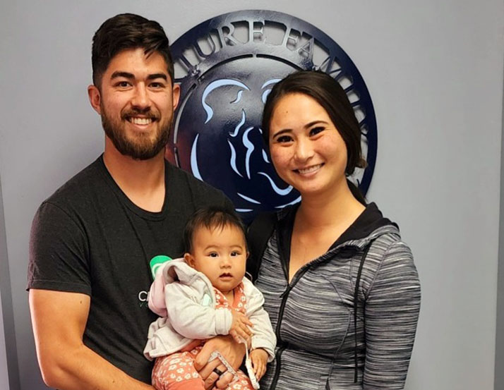 Chiropractic Simi Valley CA Family Holding Baby